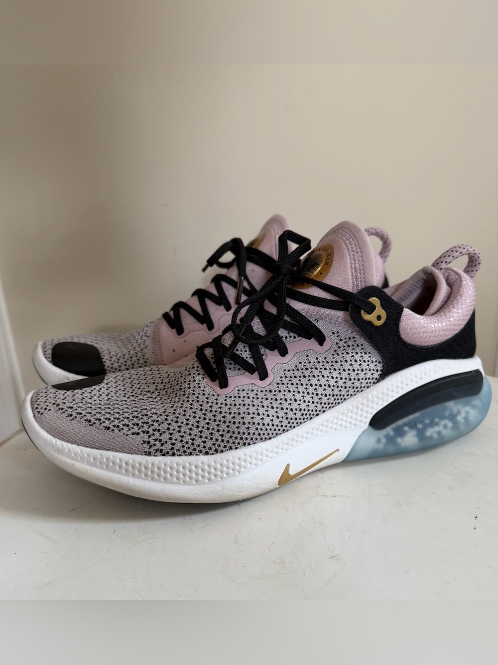 Nike woman’s Joyride Flynits plum chalk Running sneakers size- 10